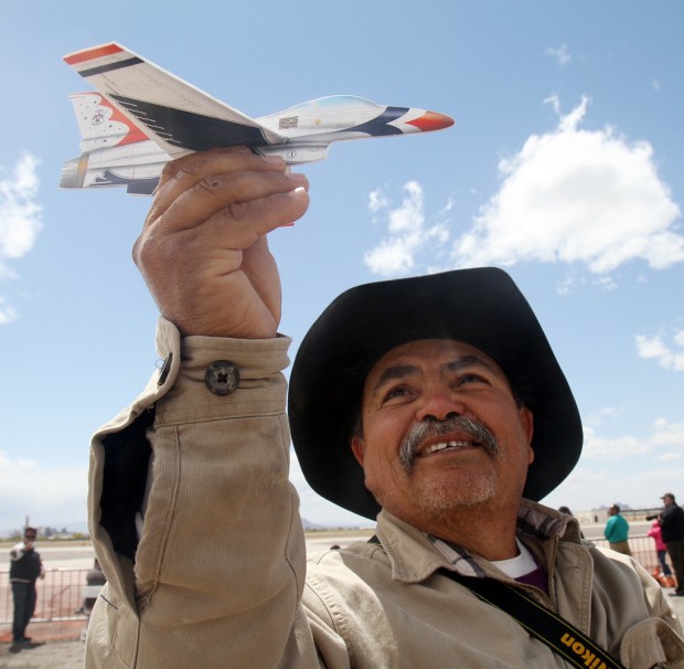 Fans of aerial acrobatics undeterred by rain, wind